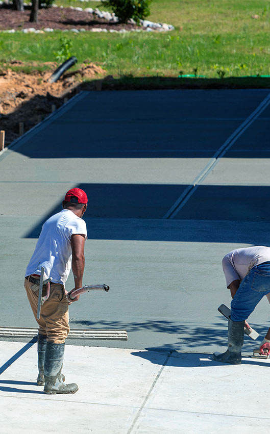two concrete contractors leveling concrete for a concrete driveway campobello sc